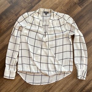 Black and white mock wrap style long sleeve blouse